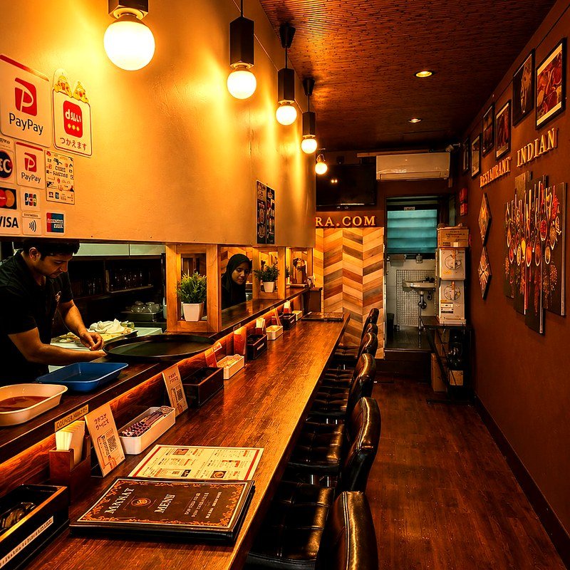 Counter seating with open kitchen at Mannat
